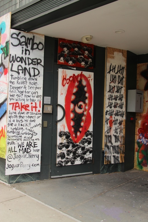 Three vertical panels depicting poetry, a vertical mouth and the face of a black woman, and a tally of hash marks.